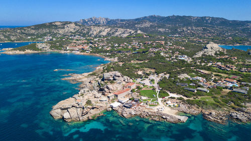 Scenic view of sea and mountain against sky