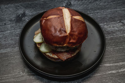 High angle view of burger on the blake plate.