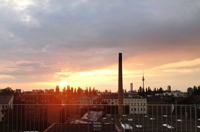 Panoramic view of buildings against sky during sunset