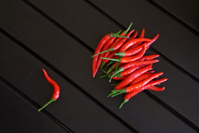 High angle view of red chili peppers on table