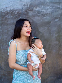 Woman and baby asian and nationality thai is happy feel