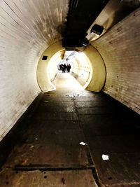 Low angle view of illuminated tunnel