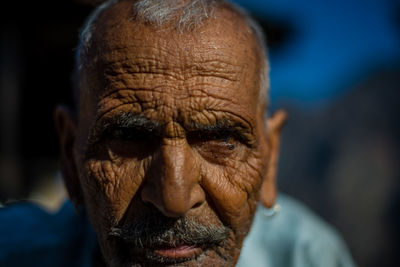 Close-up portrait of man wearing mask