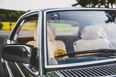 Reflection of car on side-view mirror