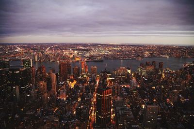 Illuminated cityscape against sky