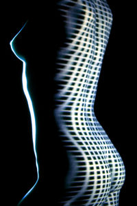 Close-up of light painting against black background