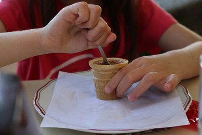 Close-up of hand holding ice cream