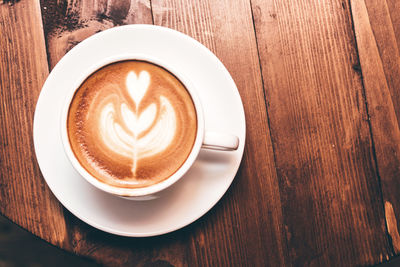 Close-up of cappuccino on table