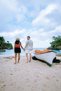 Rear view of people on beach