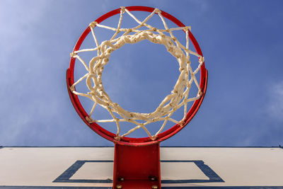 Low angle view of basketball hoop against sky