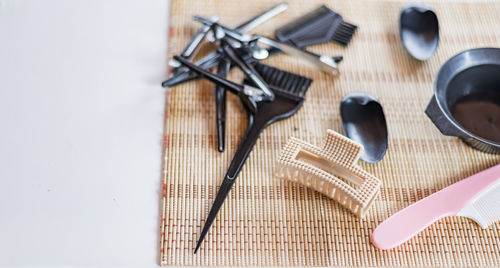 Close-up of hairdressing tools on a wooden table.