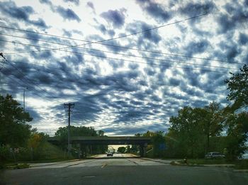 View of road against cloudy sky