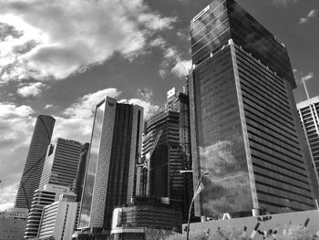 Low angle view of modern buildings against sky in city