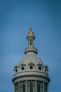 Low angle view of building against blue sky