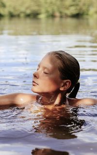 Portrait of boy swimming in pool