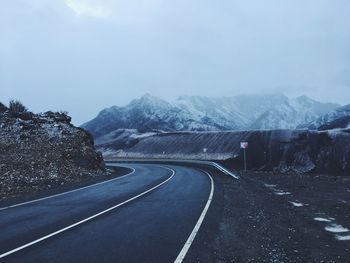Empty road along mountain range against sky. altai