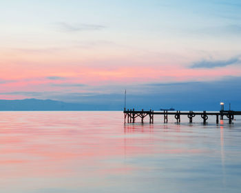 Dock and calm waters at sunset