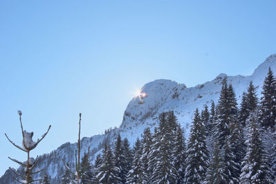 Low angle view of mountain against clear blue sky