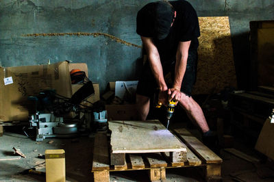 Man working on table at factory