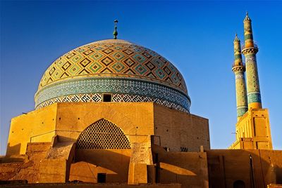 Low angle view of mosque against clear sky