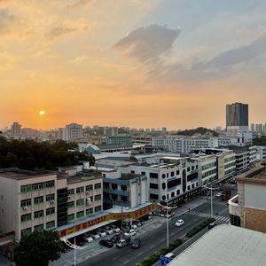 High angle view of buildings against sky during sunset