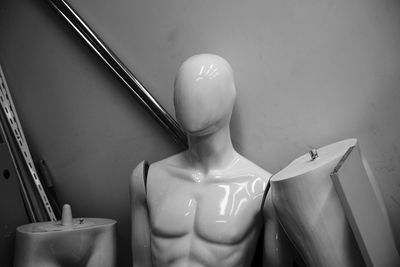 Close-up of mannequin against wall