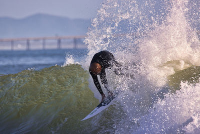 Man splashing water in sea