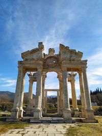 Old ruins of building against cloudy sky