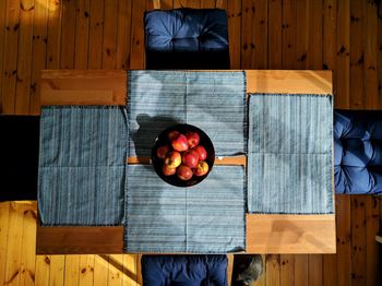 High angle view of man standing on table