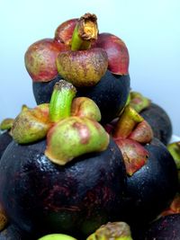 Close-up of fruits against white background