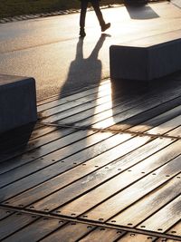 Low section of person walking on footpath