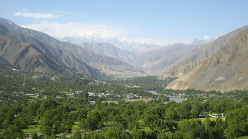 Scenic view of lush foliage against mountains