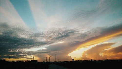 Scenic view of cloudy sky at sunset