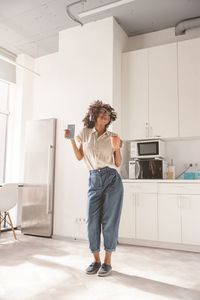 Side view of young man working at home