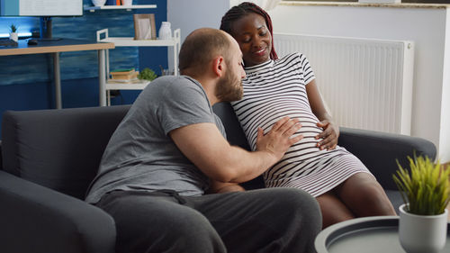 Man touching pregnant wifes stomach