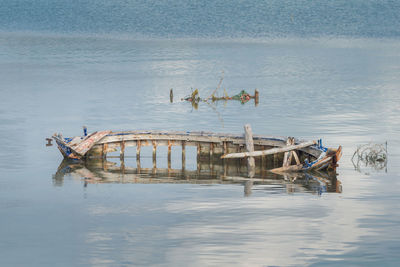 Abandoned boat in lake