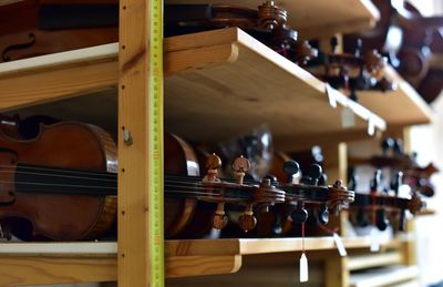 Close-up of violins for sale at store