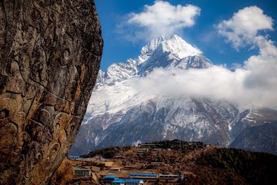 Scenic view of snowcapped mountains against sky