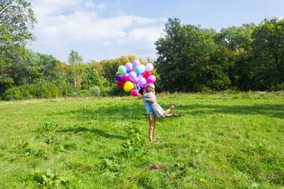 Full length of woman on field against sky