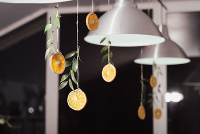 Zero waste home decor. dried oranges garlands on jute rope. hanging dry citrus fruits slices. 