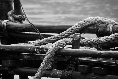 Close-up of rope tied on wood