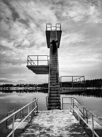 Pier over lake against sky