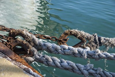 High angle view of ropes attached on ropes at harbor