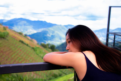 Young woman looking at mountains