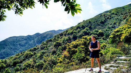 Portrait of man on mountain against sky