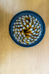 Overhead view of pencils in bowl