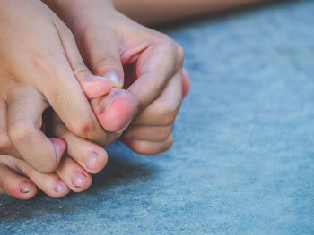 Close-up of hands holding baby feet