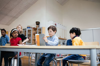 Friends sitting on table