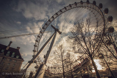 Low angle view of ferris wheel against sky