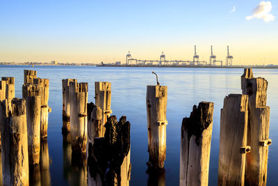 Panoramic view of wooden posts of princes pier in sea against sky